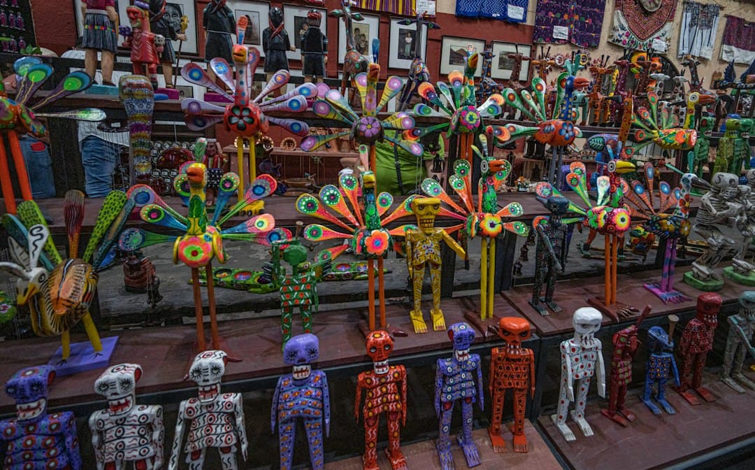 Colorful giant kites and skeleton figures displayed during a Day of the Dead celebration in Guatemala.