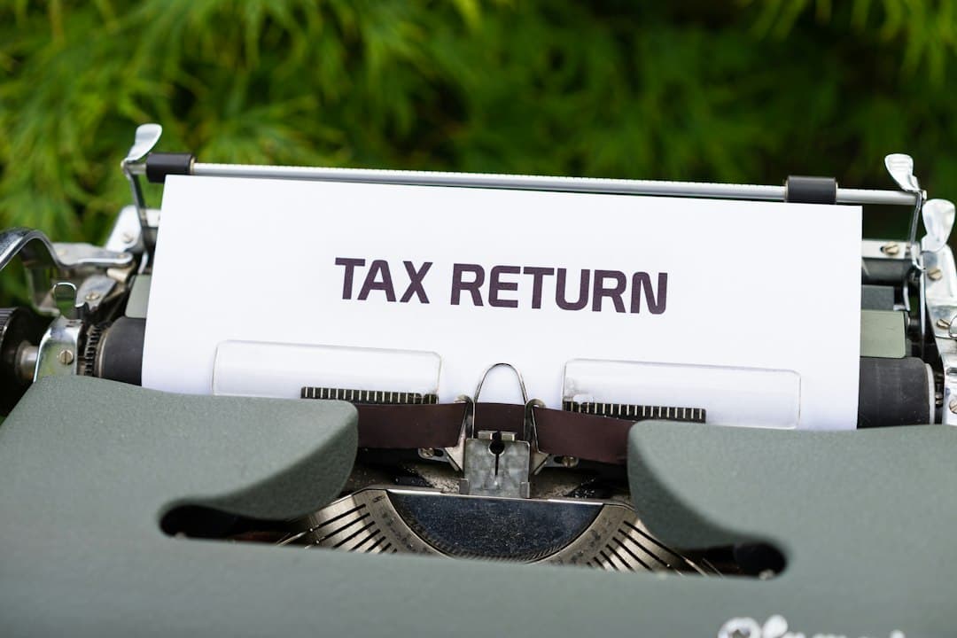 Typewriter with a TAX RETURN document, symbolizing the tax filing and tax questions