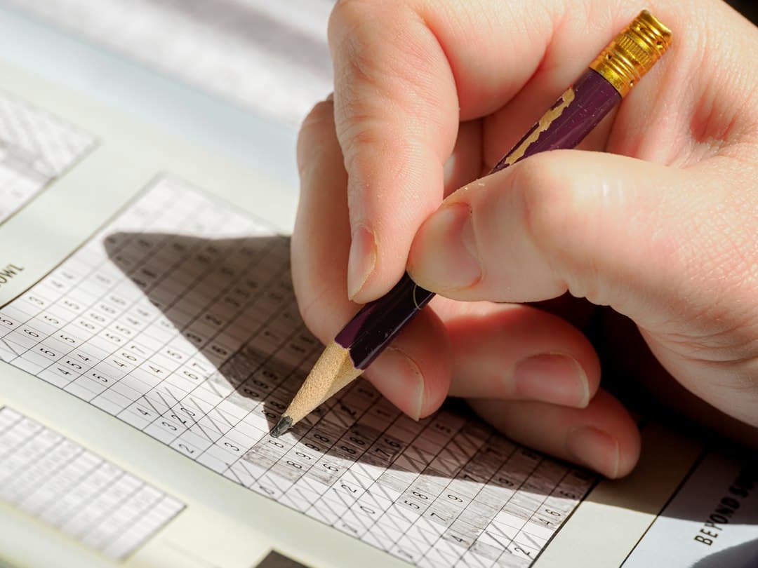 Hand holding a pen filling out a declaration form with checkboxes
