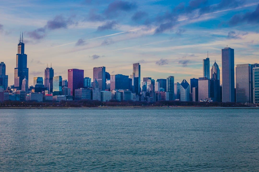 Chicago skyline with skyscrapers along Lake Michigan at dusk.